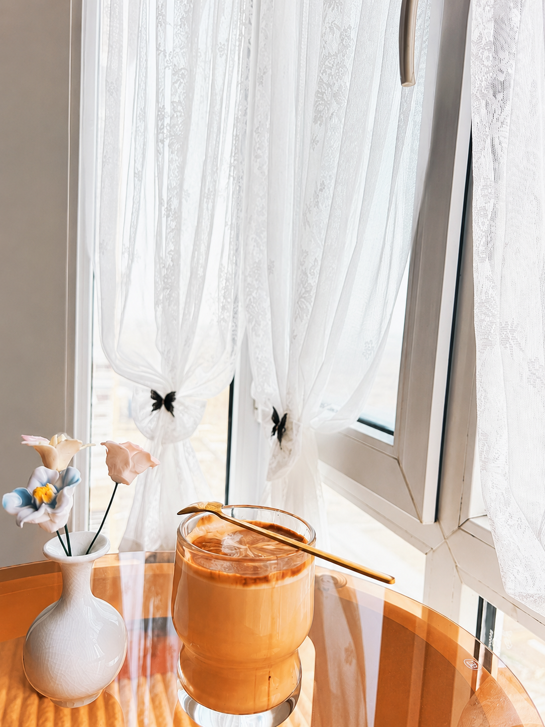 Custom white lace cafe curtain fitted to a small window